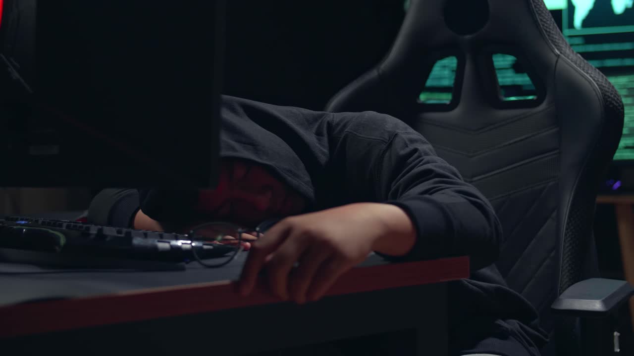 Asian Boy Hacker Sleep On Computer Table