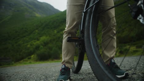 slow motion mid shot of cyclists foot moving onto pedal