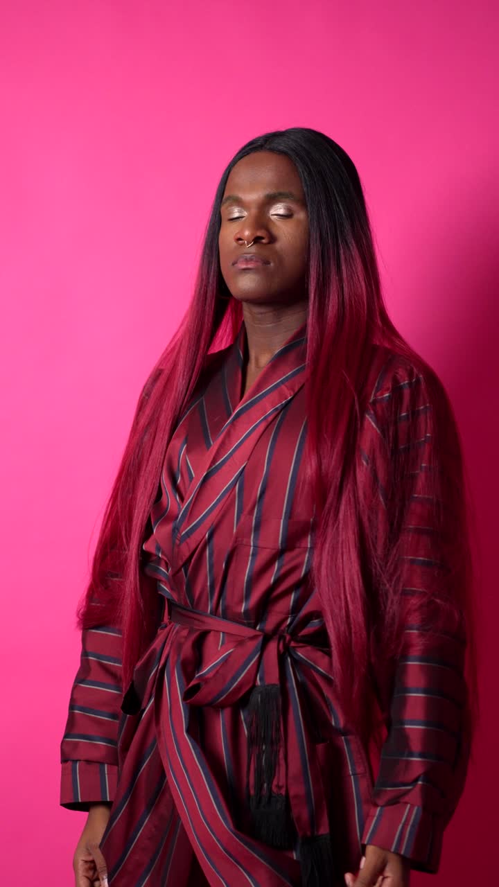 Person with red hair in bathrobe