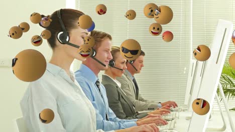 Animation-of-emoji-falling-over-business-people-wearing-phone-headsets