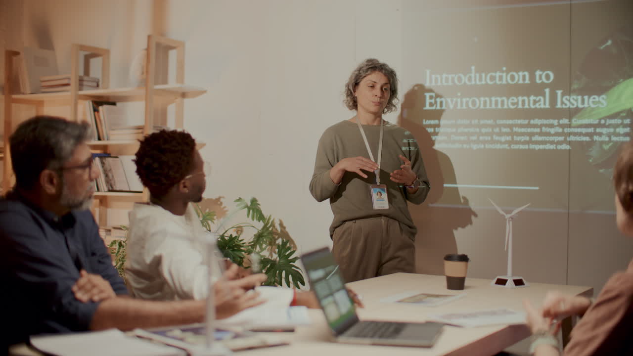 Female Engineer Leading Presentation on Climate Change during Office Meeting