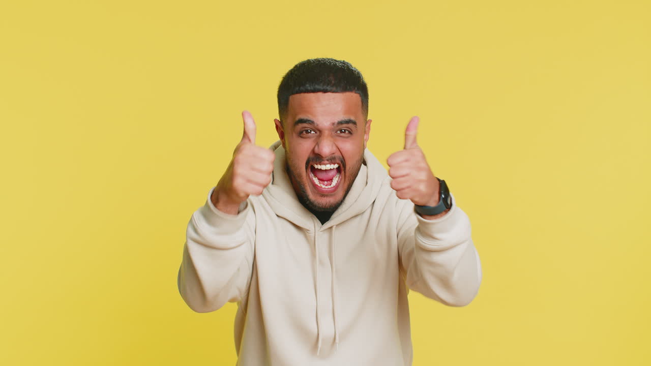 Happy indian man celebrating success winning birthday lottery jackpot goal achievement good news