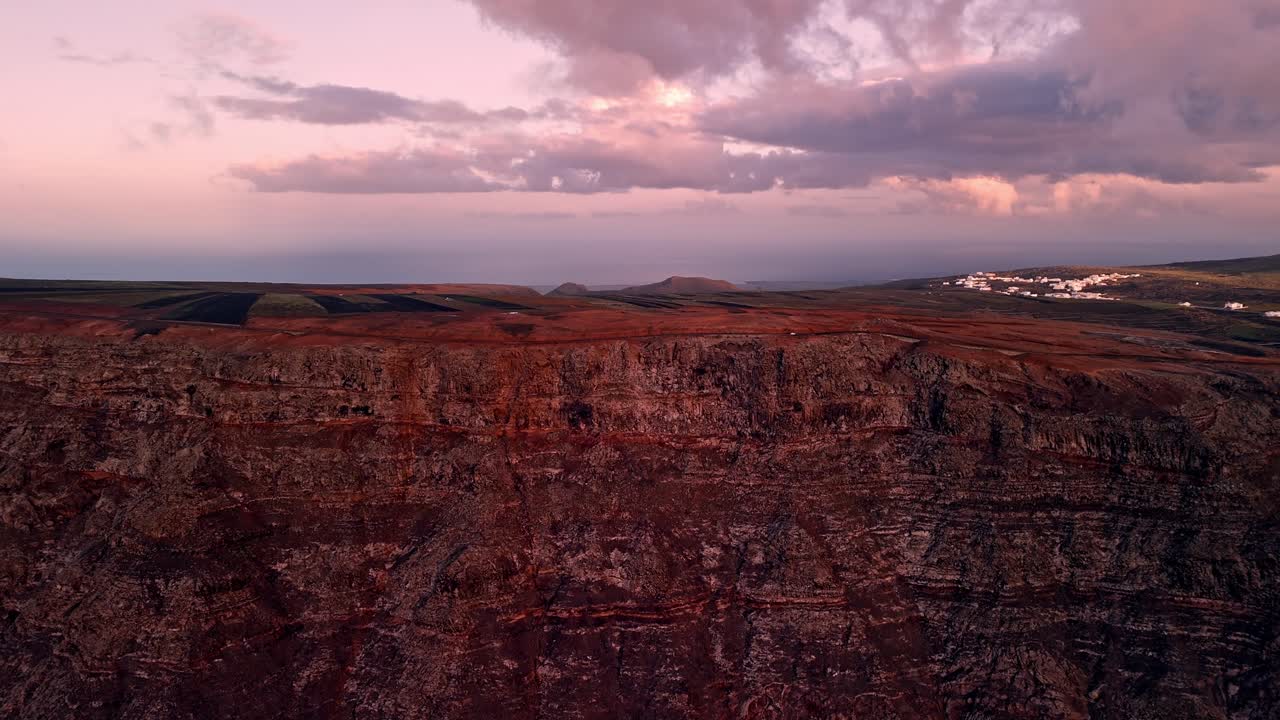 Breathtaking aerial drone footage captured at sunset from El Mirador del Río in Lanzarote, Canary Islands, Spain.