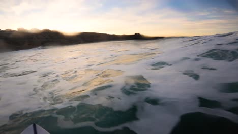 surfing in ribeira d'ilhas in ericeira on a sunny day