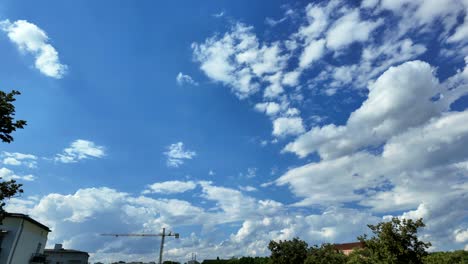 background, timelapse, white clouds forming in the blue sky