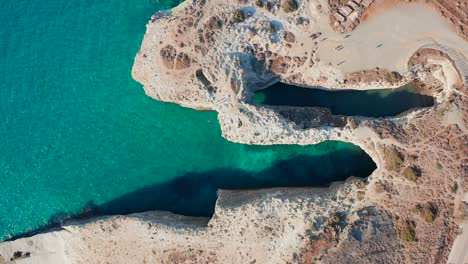 papafragas caves aerial topdown drone milos island greece