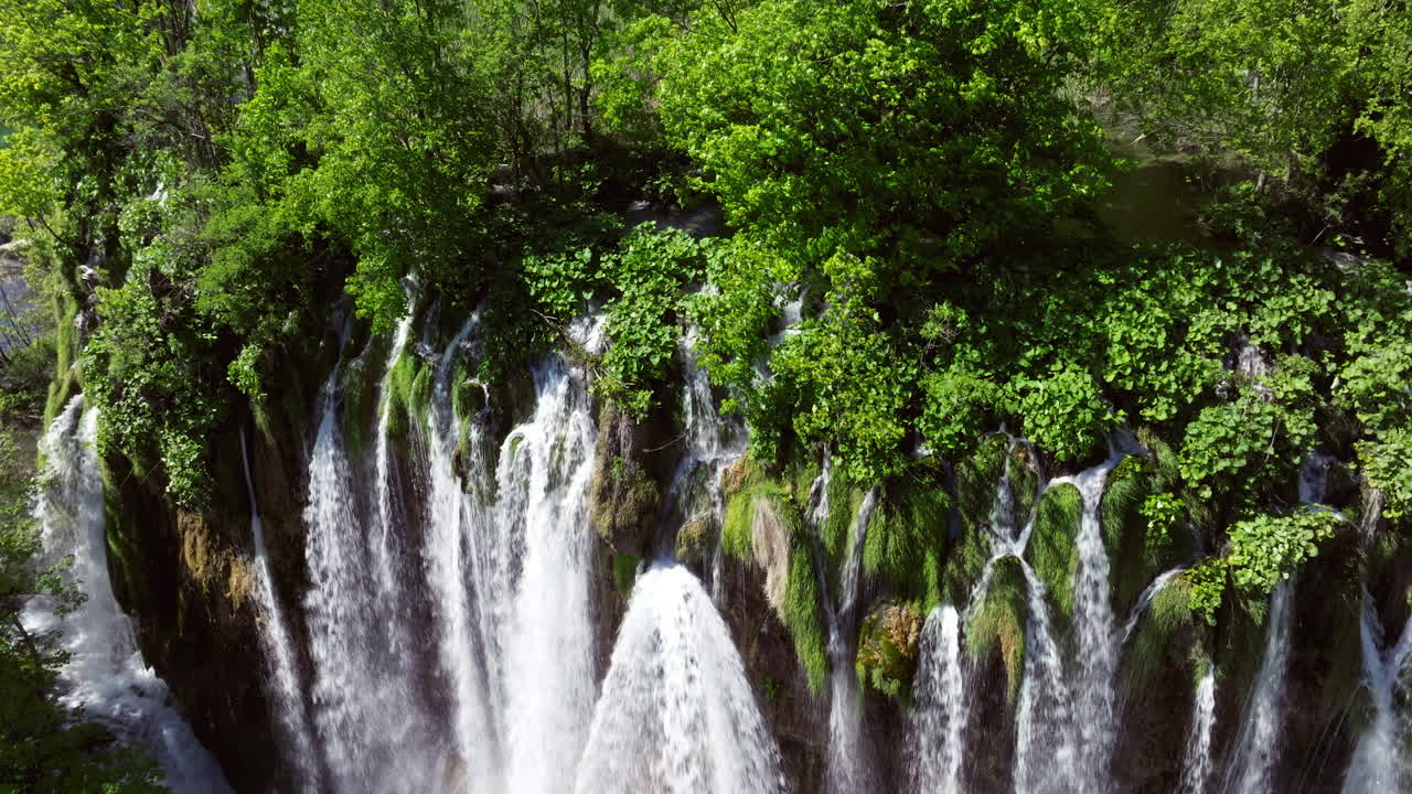 Fresh Water Flowing On The Waterfalls At Plitvice Lakes National Park In Croatia. - aerial shot