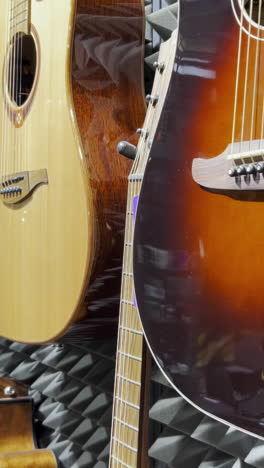 shop with acoustic guitars. different types of guitars.