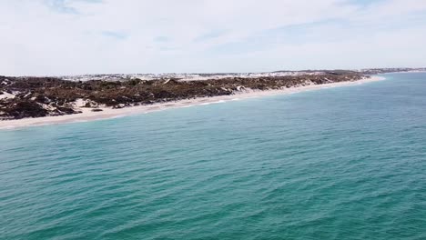 Gentle-waves-and-sand-dunes-at-Eden-Beach,-Perth-Western-Australia