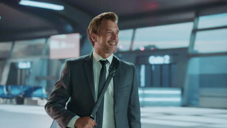 a businessman is walking in an airport terminal