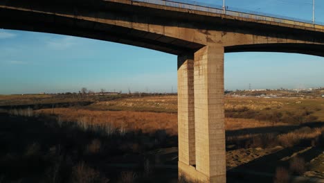 revealing shot of galati viaduct bridge on sunny day in galati, romania. drone ascend
