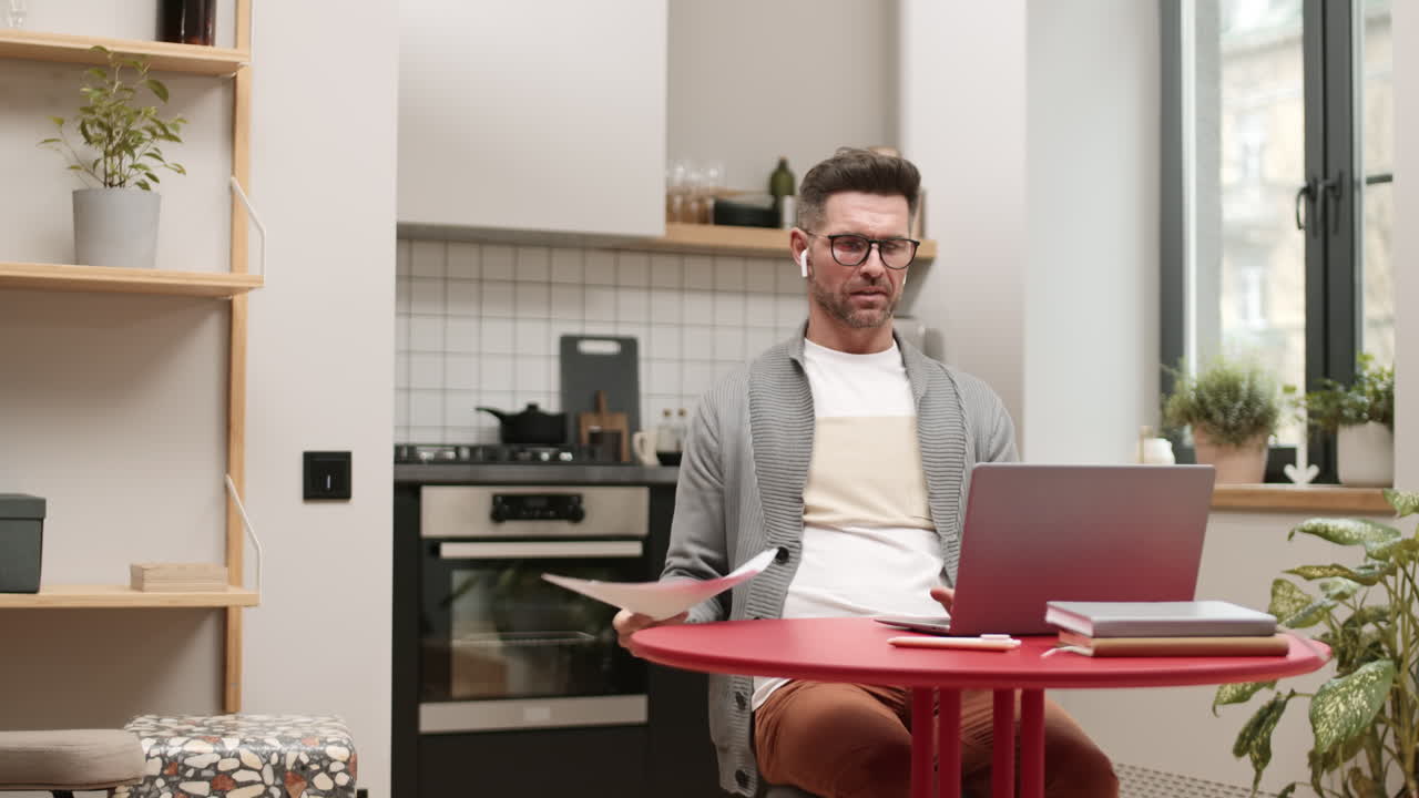 Man Having Video Conference at Home