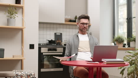 man having video conference at home