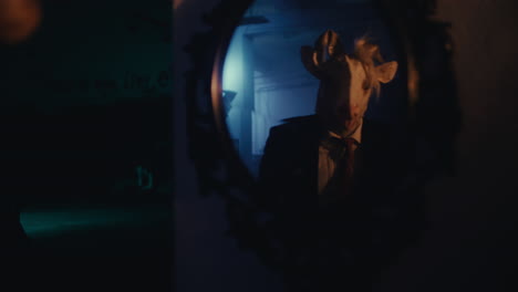man in unicorn mask reflecting in mirror