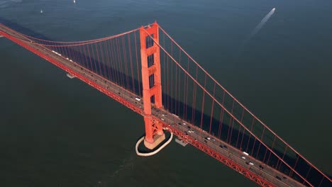 Aerial-view-of-traffic-on-the-historic,-Golden-gate-bridge---high-angle,-circling,-drone-shot