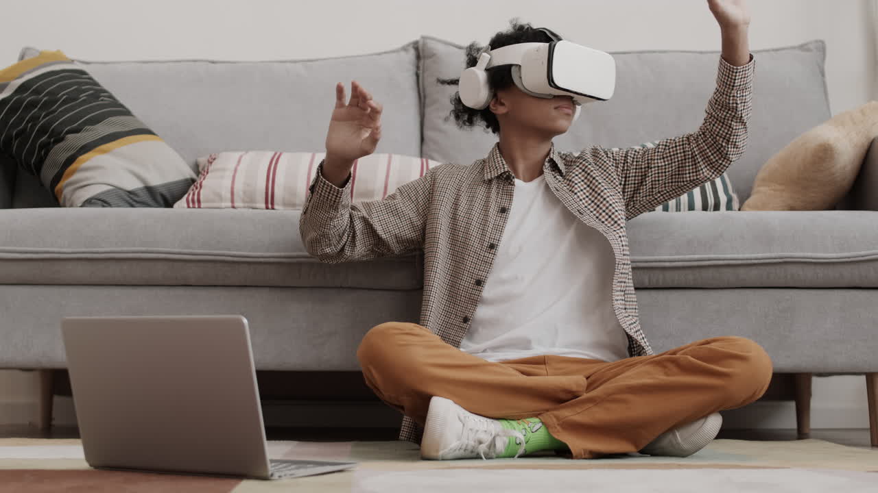 Person using VR Headset with Laptop