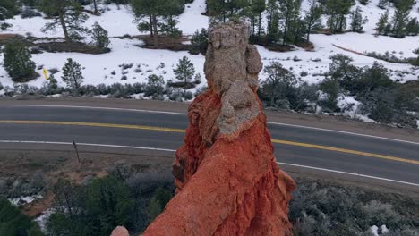 aerial drone view red granite rock formations at the highway in bryce canyon national park, utah usa