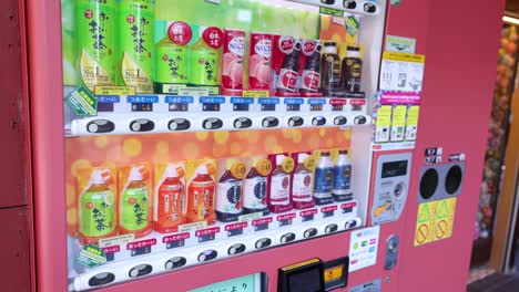 a sequence showing a person choosing a drink from a vending machine