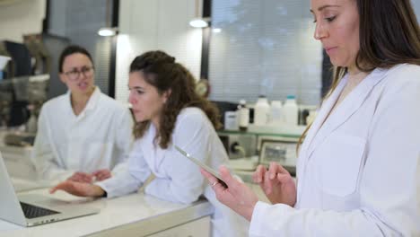 Group-of-scientists-discussing-research-details-in-lab