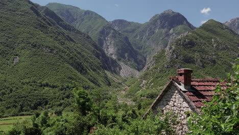 old stone house with beautiful mountain in the background