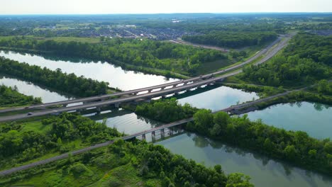 Aerial-shot-of-Highway-406-bridge-crossing-over-Welland-Canal-and-River,-Canada