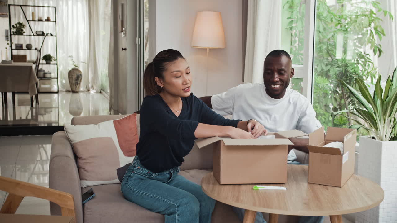 Woman Trying Hoodie on Husband when Checking Online Purchases