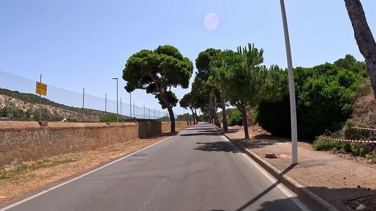 Point of view, sunlight journey, picturesque Italian highway, Cagliari