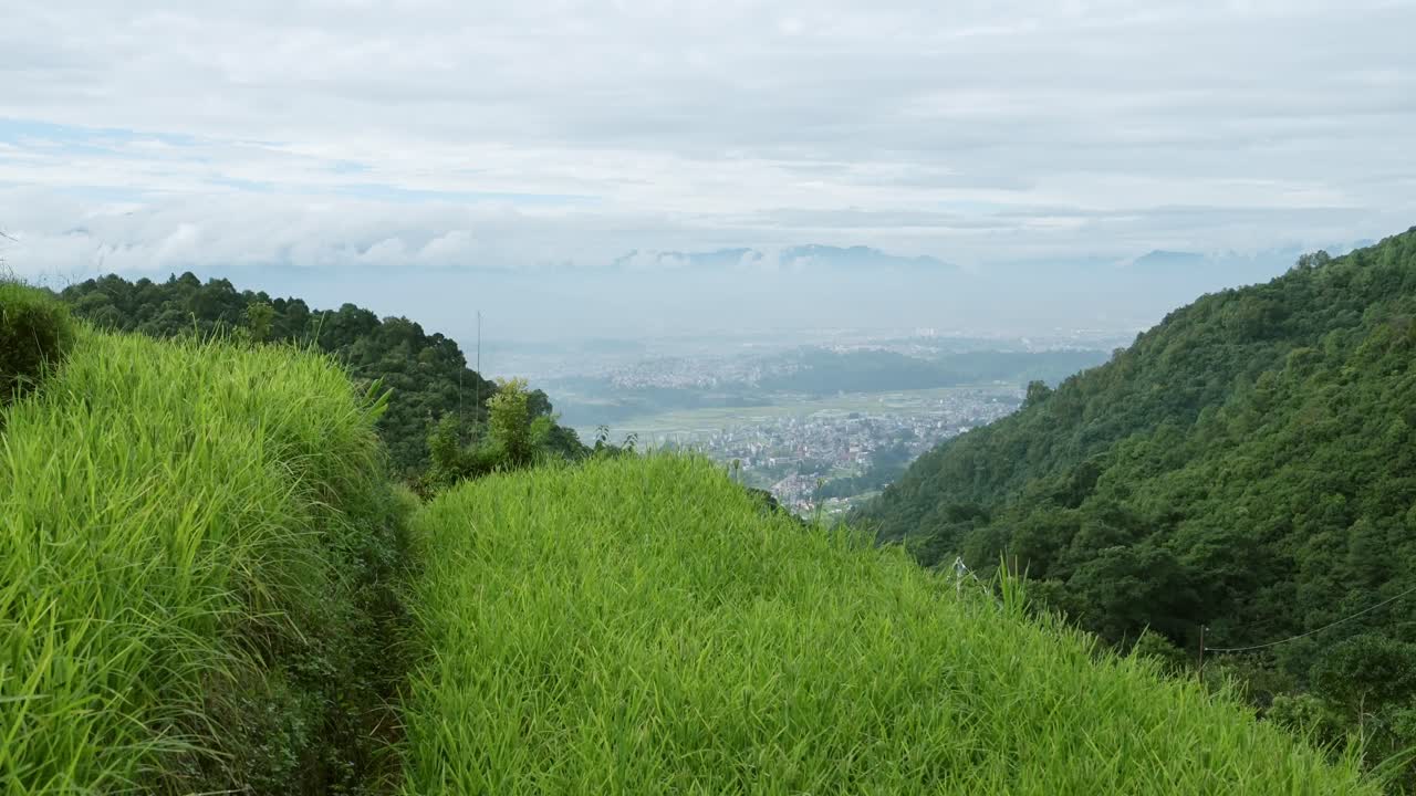 Rural Scenery and Kathmandu in Nepal, Rice Fields Paddies and Paddy Fields Terraces in a Rural Village in Kathmandu Valley with the City Behind, Rural Village Scene