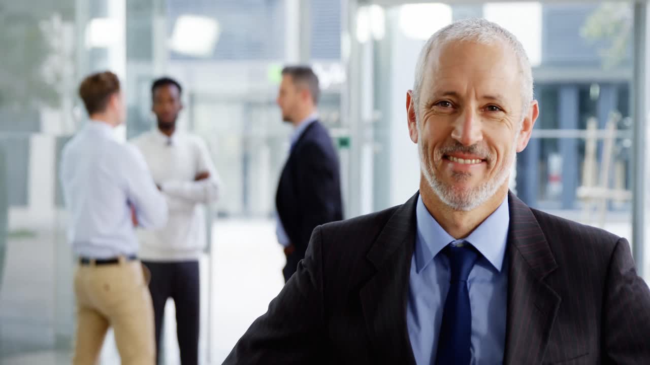 Smiling businessman in office