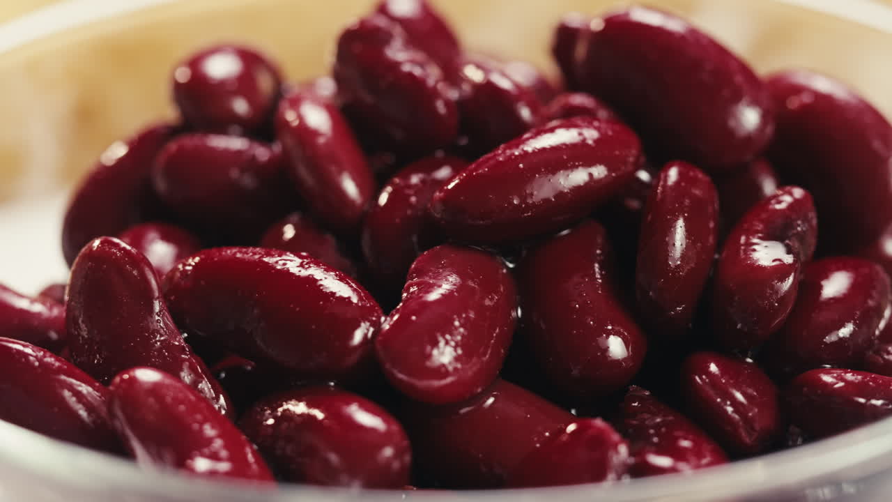 Canned red bans preserved beans rotating background close up side view. Organic steamed beans. Pickled bean for a Mexican dish
