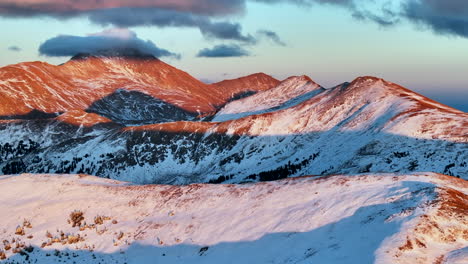 Mount-Yale-Colligate-Peaks-first-snow-golden-hour-aerial-cinematic-drone-dramatic-Rocky-Mountains-sunset-pink-orange-red-stunning-freezing-cold-frozen-Monarch-Pass-Salina-Buena-Vista-Colorado-backward