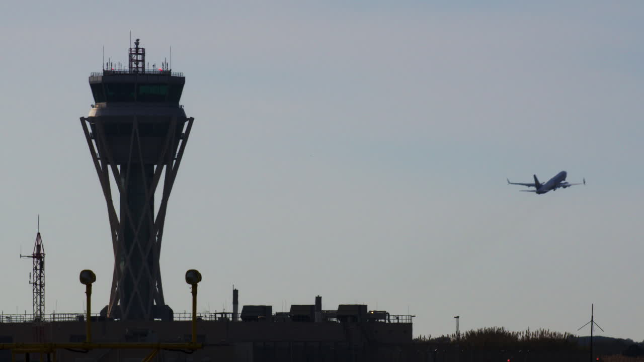 Airport Tower and Airplane Takeoff