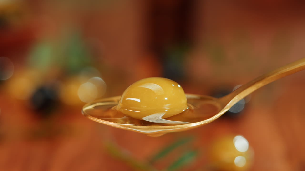 Spoonful of Olives with Dripping Olive Oil