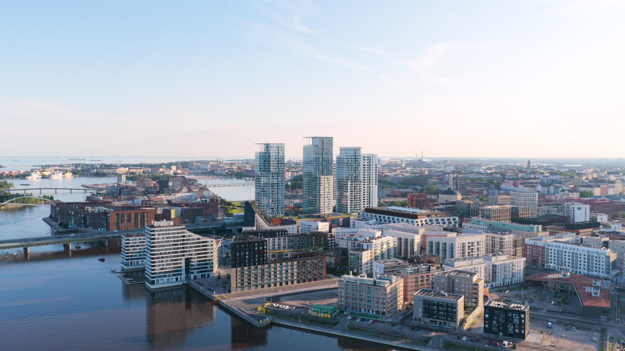 Drone flying toward Verkkosaari district and the Kalasatama towers of Helsinki