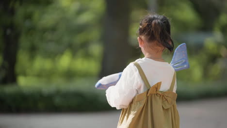 child with blue airplane