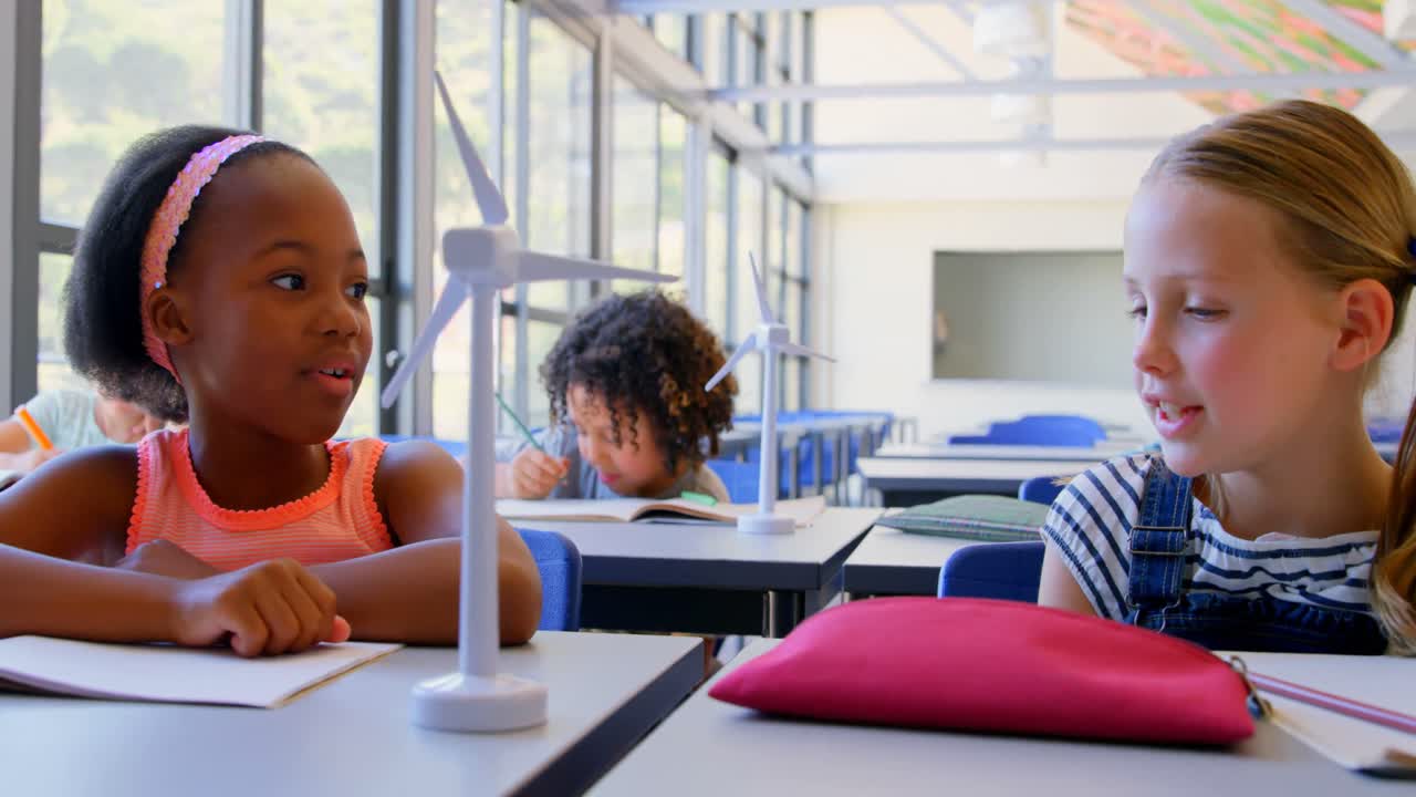 Schoolkids studying at desk in the classroom at school 4k