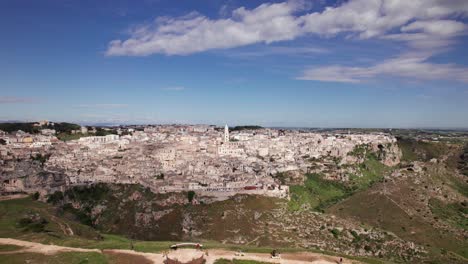 Aerial panorama of old city Matera from a hill viewpoint, wide, Italy