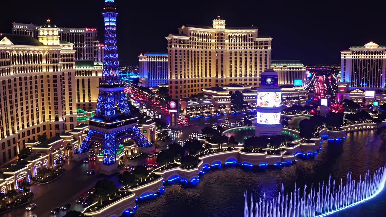 Aerial video of Las Vegas Strip at night, showcasing vibrant lights and iconic landmarks from a high