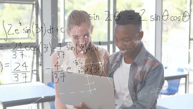 Mathematical equations with figures and two students using a laptop
