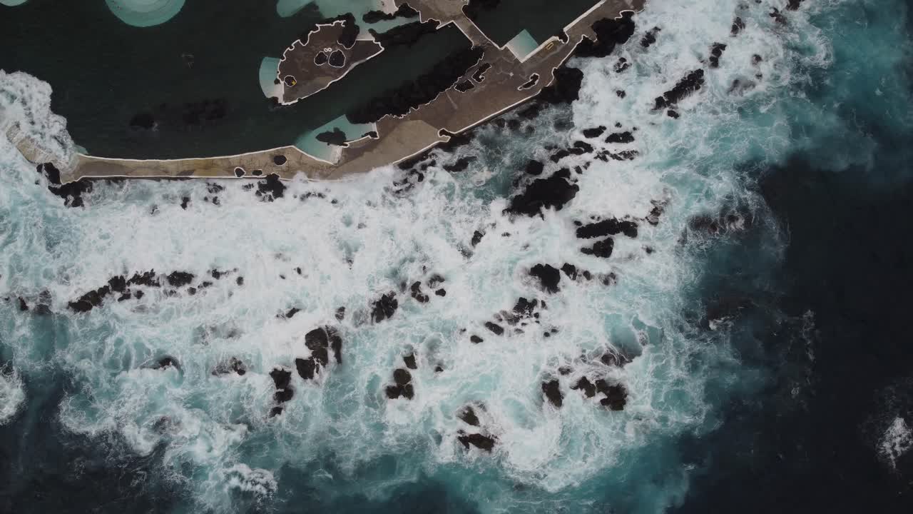 A top down view of the crashing waves in Madeira