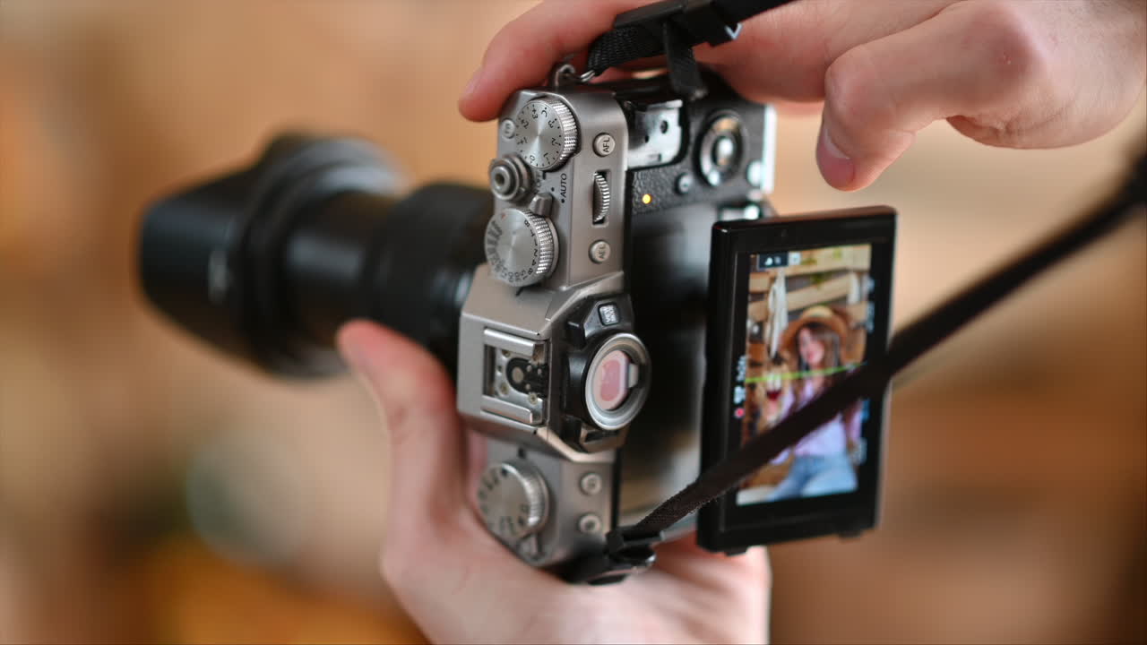 Camera filming a woman drinking a glass of red wine and dancing