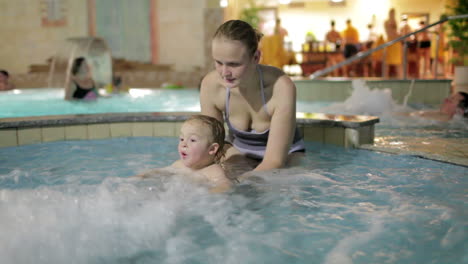 mother with kid in the spa-salon