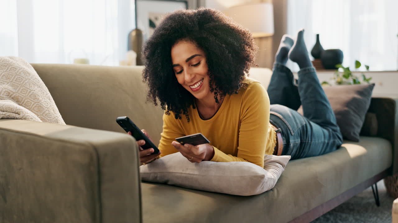 Woman using phone on couch
