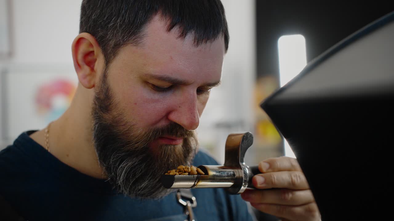 Coffee Roaster Examining Coffee Beans