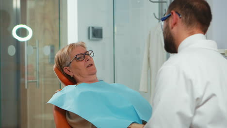 close up of patient talking with stomatologist