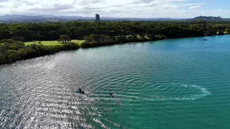 boat creating circular patterns on the river