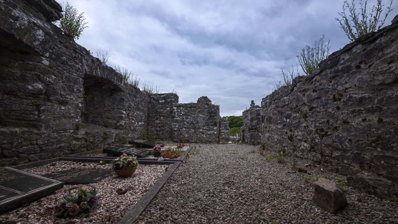 Motion time lapse of Creevelea Abbey medieval ruin in county Leitrim in Ireland as a historical sightseeing landmark and graveyard with dramatic clouds in the sky