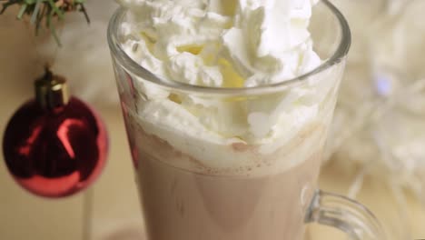 hot chocolate drink at christmas decorated with whipped cream