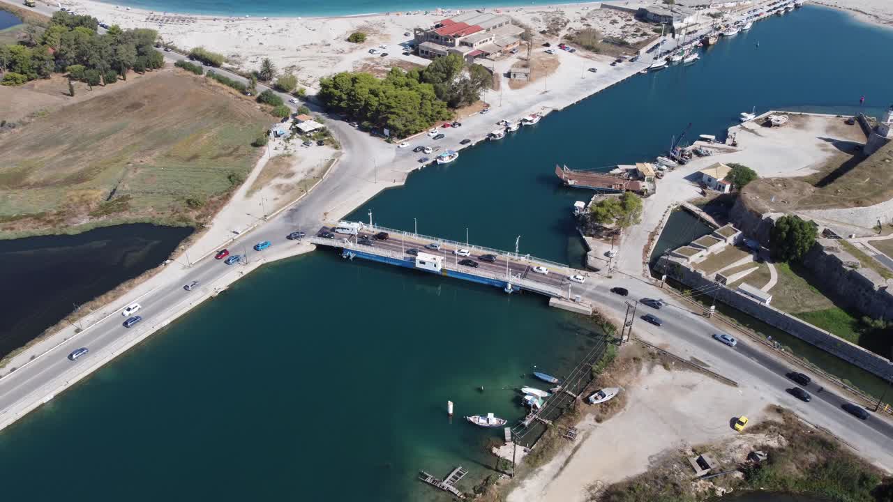 Lefkada Harbour main canal and floating rotating bridge brids eye view stock video