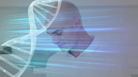 Animation-of-rotating-dna-helix-with-lightbeam-over-bald-smiling-businessman-using-digital-pc